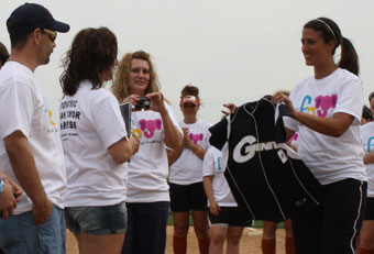 Carsey being presented with an official Geneva softball jersey.