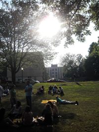 Students relaxing on Memorial Lawn during orientation.