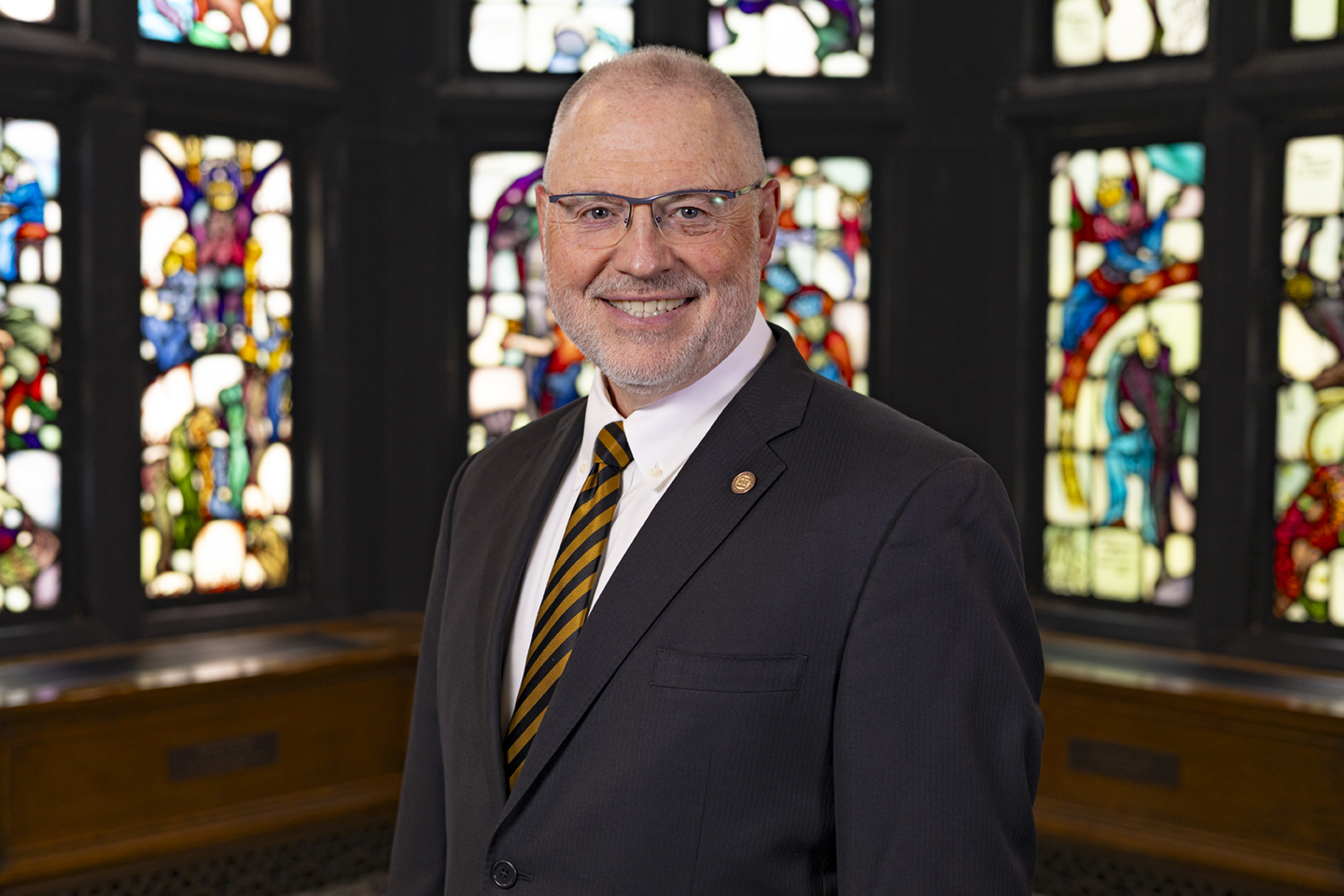 Geneva's President, Calvin L. Troup standing in his office