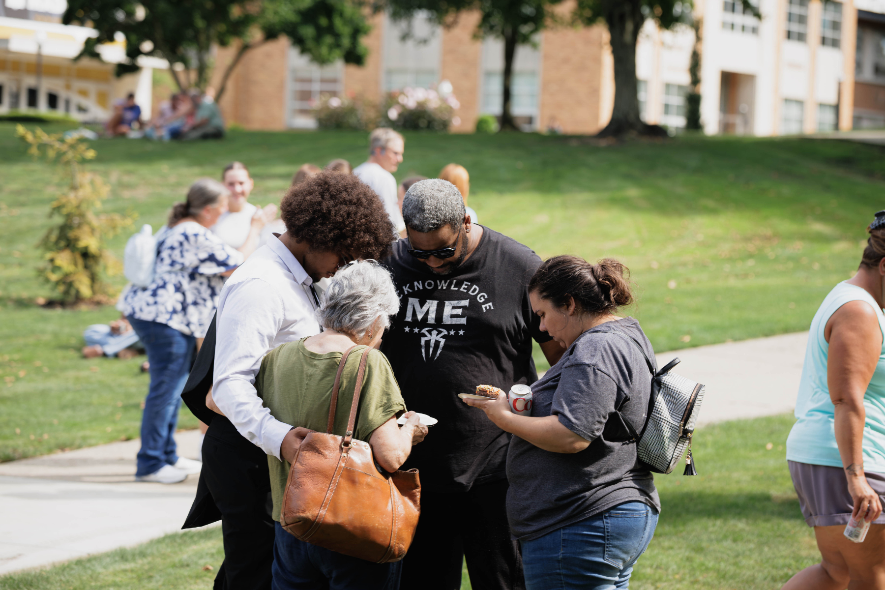 Families pray over their students