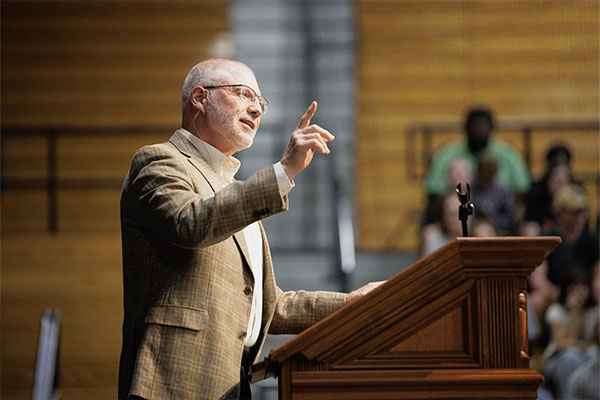 President Troup speaking to the student body at chapel