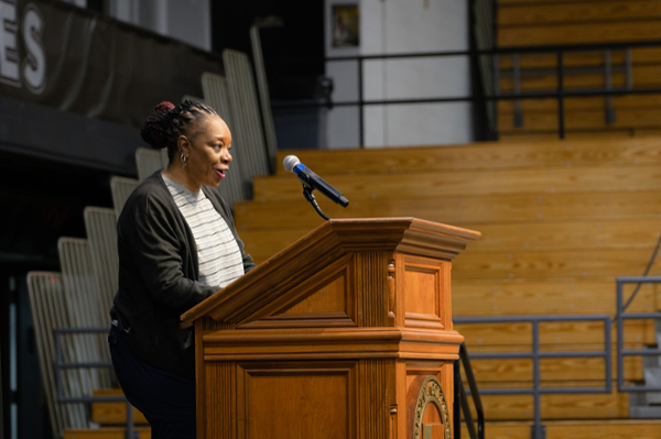 Professor Mildred Johnson speaking to Geneva students at Chapel.