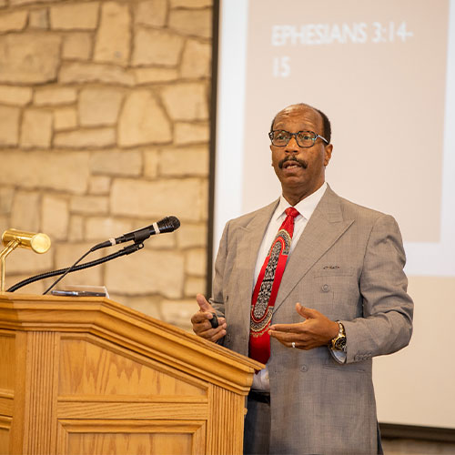 Dr. Nickols speaking at a podium at a past GVALS event.