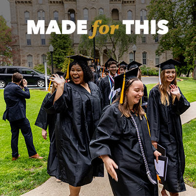 Students celebrating Commencement in front of Old Main