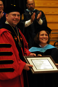 Dr. Adel Aiken receives the Excellence in Teaching award.