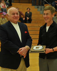 Dr. Kim Gall presents an Honorary G to Peter Napoli who accepted it for his wife Virginia.