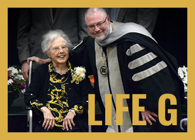 photo of Madge receiving the award at commencement