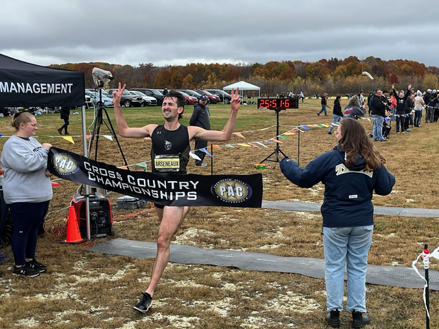 Junior Kevin Arseneauz crossing the finish line during the PAC Championship