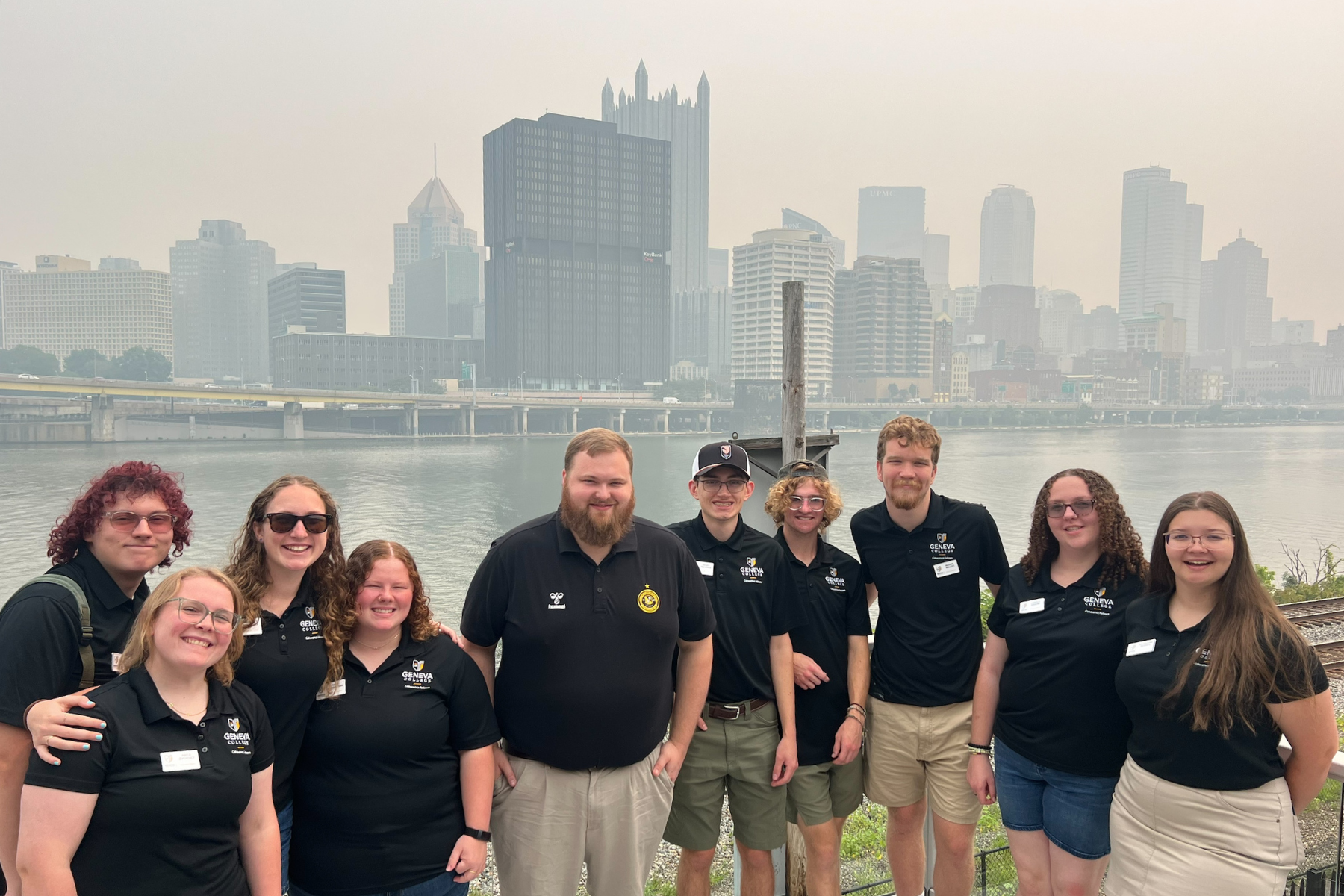 The Summer Fellows in front of the Pittsburgh skyline