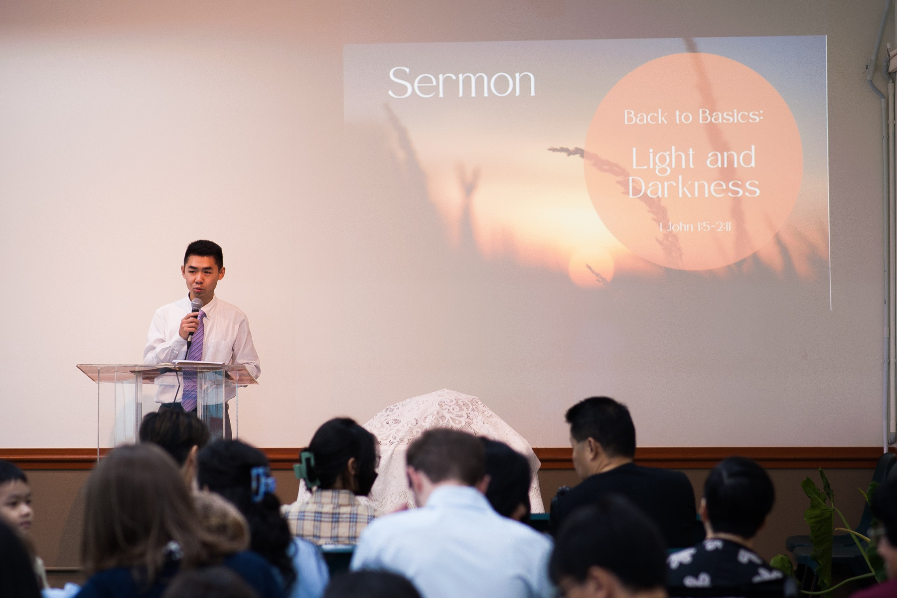 Josh Ng preaching at the first service in their new building