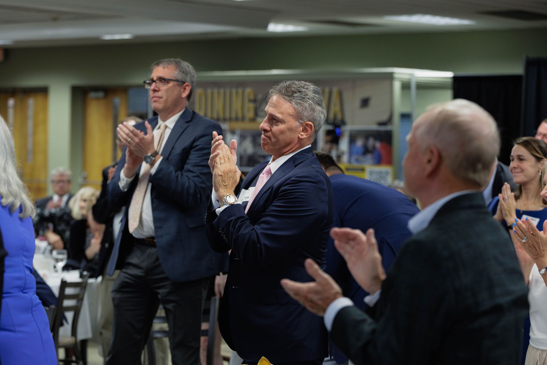 Foundation board members, alumni, and friends give Liz Samuelsen a standing ovation