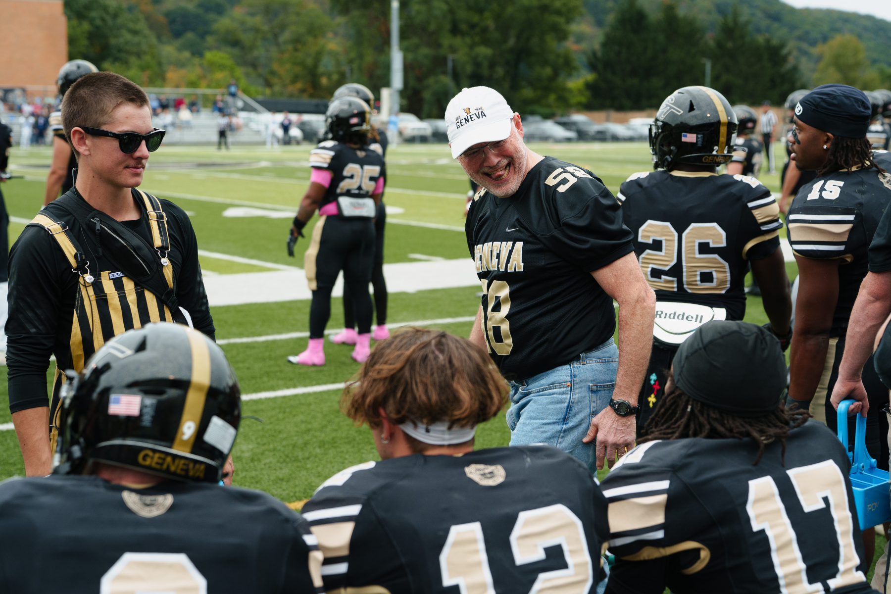 President Troup on the Sidelines With Football Players